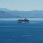 Passenger ferry and cruise ship sailing in the Ionian Sea near Corfu.