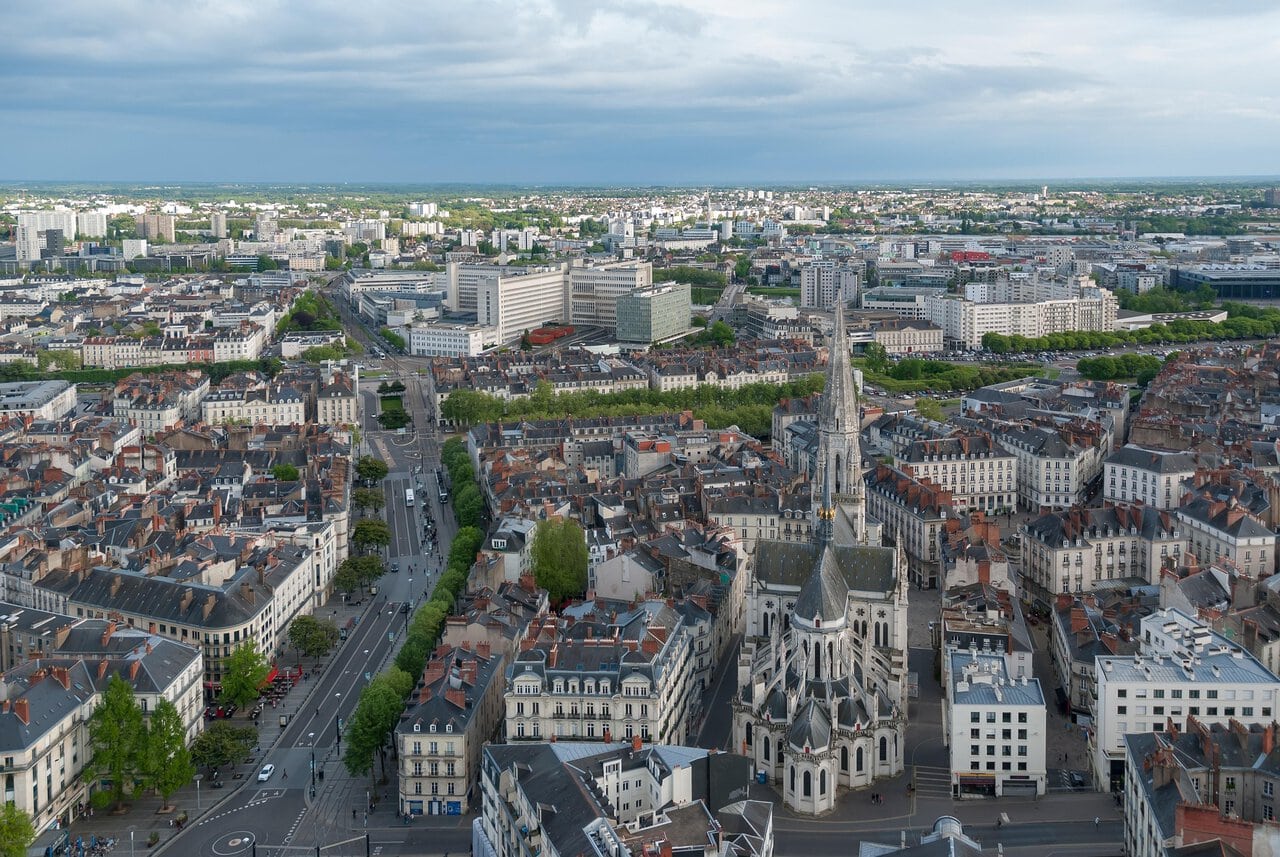 Aerial view of Nantes city centre with Saint Nicholas Church and surrounding streets.