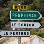 Road sign pointing towards Perpignan in southern France