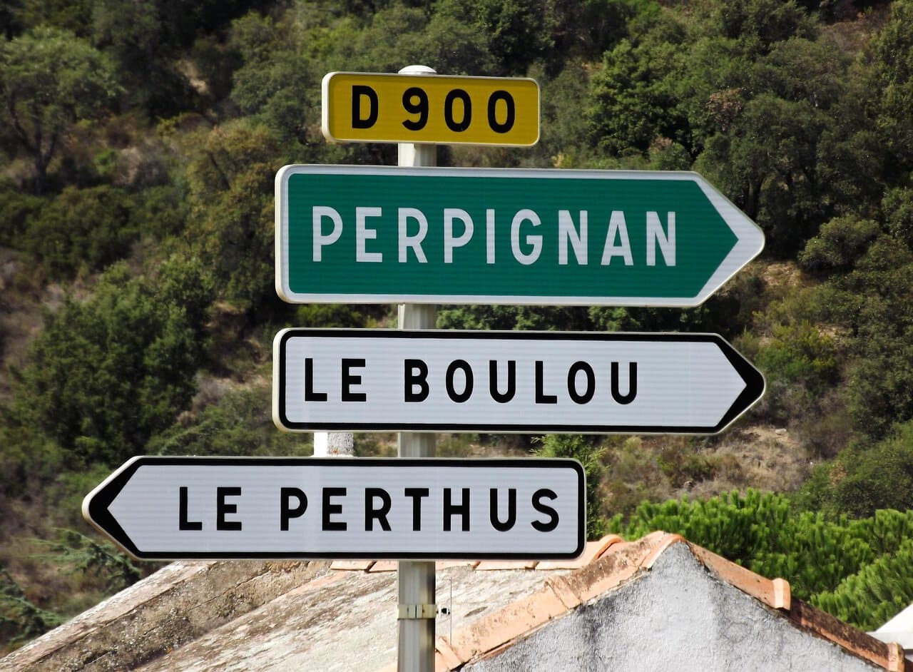 Road sign pointing towards Perpignan in southern France