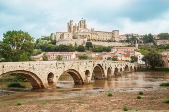 View of Béziers Cathedral and the historic Pont Vieux crossing the River Orb