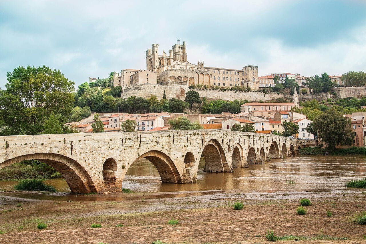 View of Béziers Cathedral and the historic Pont Vieux crossing the River Orb