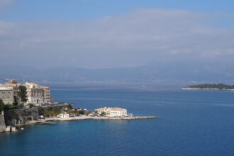 View across Corfu Old Town and the Ionian Sea from the Old Fortress in Corfu, Greece.