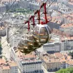 View over Grenoble with the Bastille Cable Car and surrounding Alps