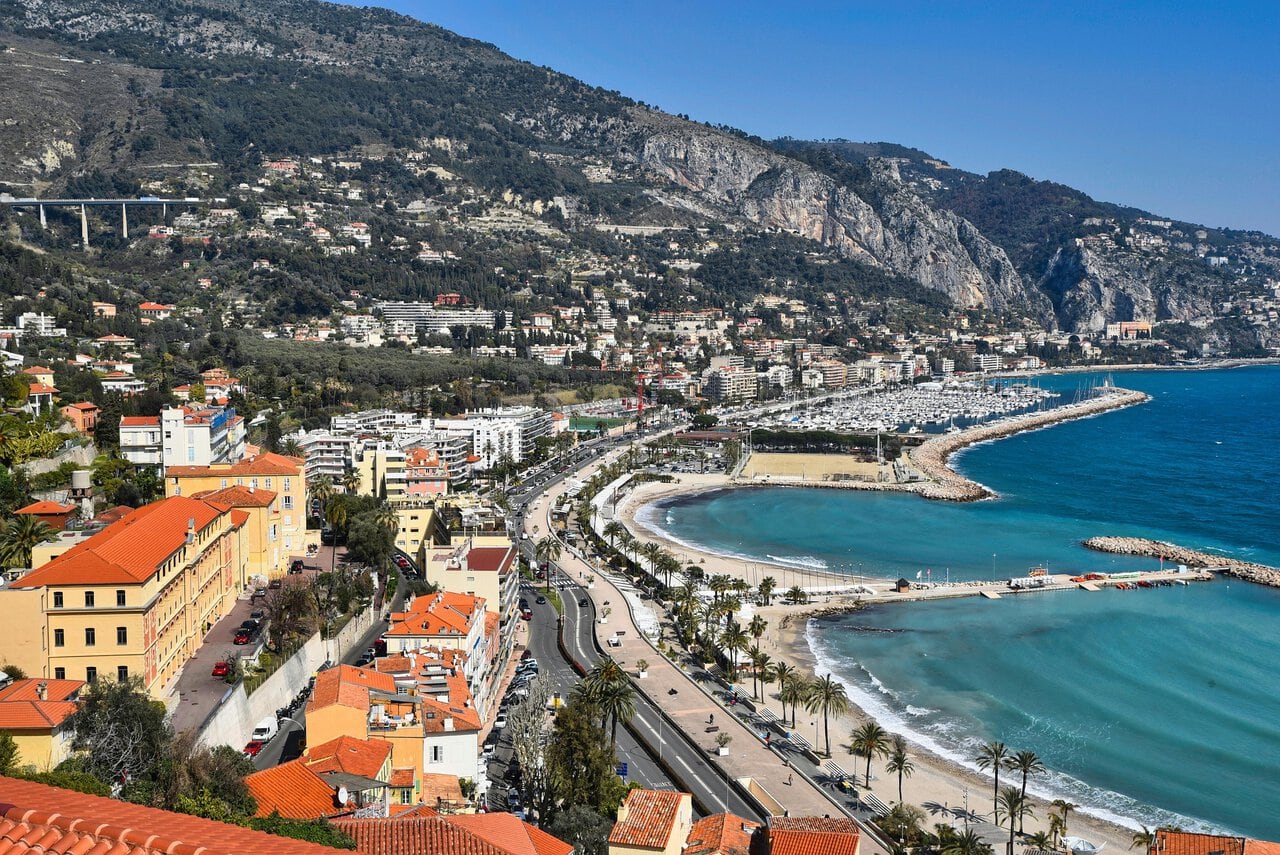 Colourful pastel houses of Menton's Old Town rising above the Mediterranean on the French Riviera