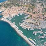 Colourful harbour of Saint-Tropez with luxury yachts and Provençal buildings on the French Riviera