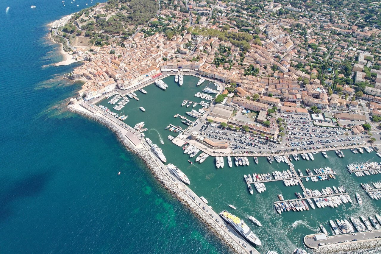 Colourful harbour of Saint-Tropez with luxury yachts and Provençal buildings on the French Riviera