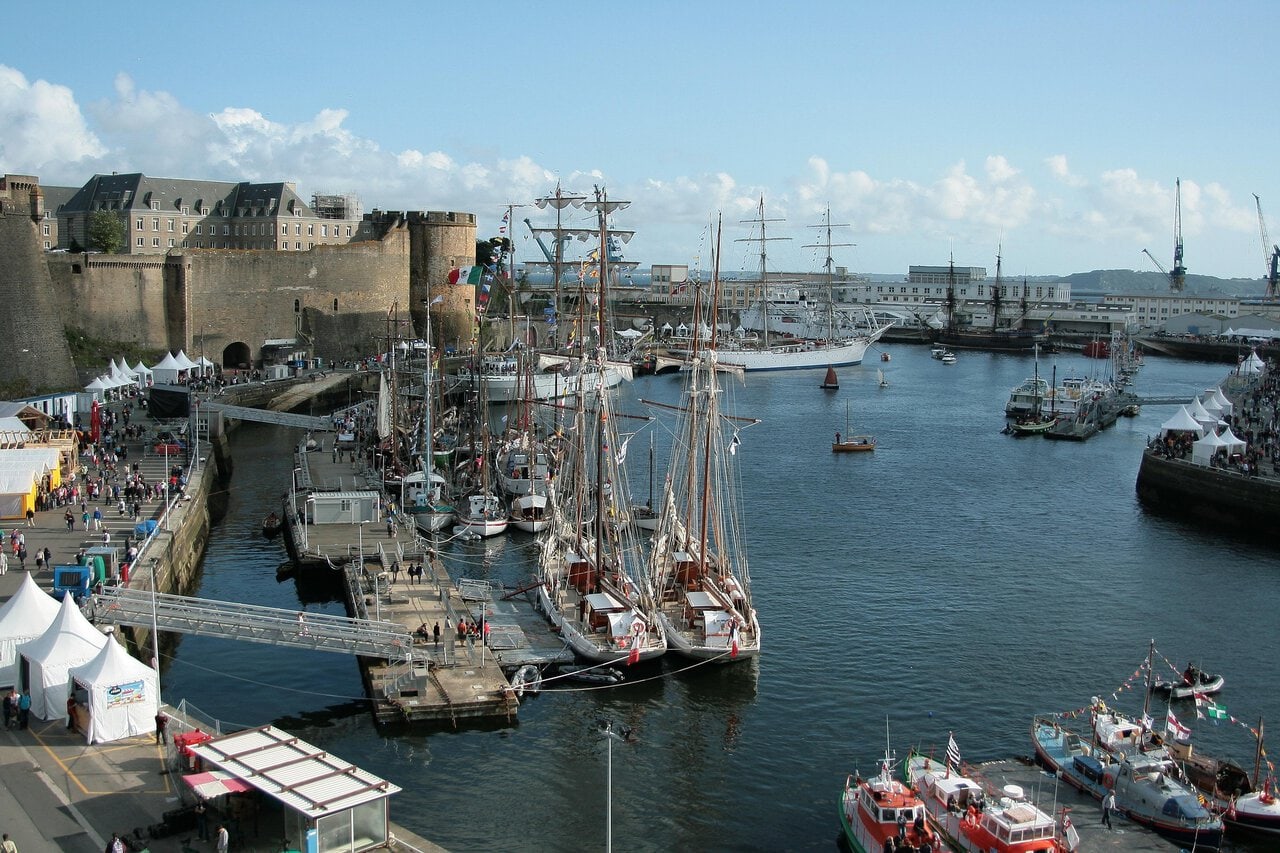 Tall ships and sailing vessels moored in the harbour at Brest, Brittany, France.