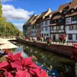 Colourful half-timbered houses lining the Little Venice canal in Colmar