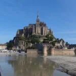 Mont Saint-Michel and its medieval abbey surrounded by tidal sands in Normandy, France