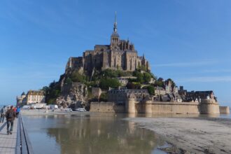 Mont Saint-Michel and its medieval abbey surrounded by tidal sands in Normandy, France