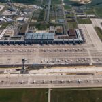 Aerial view of Berlin Brandenburg Airport terminal, runways and aircraft