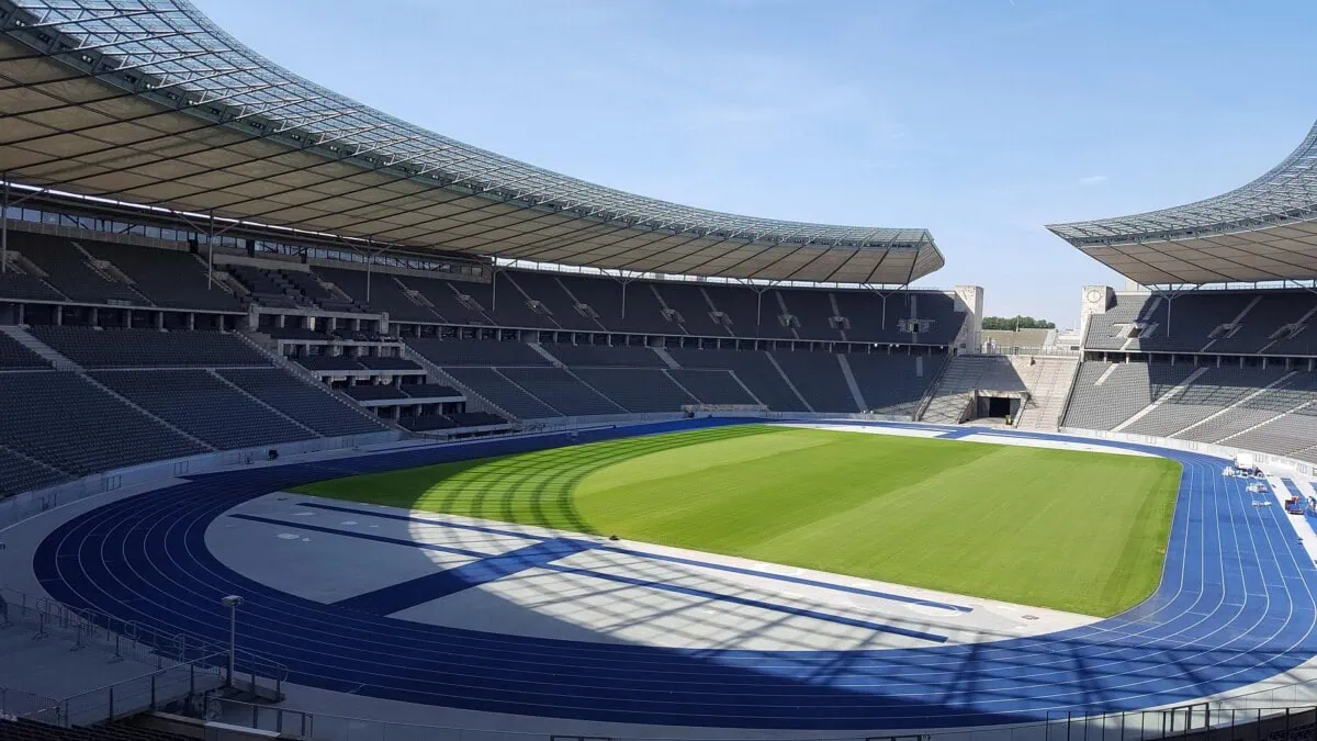 Inside Berlin Olympiastadion with the blue running track and football pitch