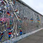 Colourful mural artwork on a surviving section of the Berlin Wall