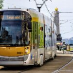 STIB tram travelling through Brussels with overhead power lines