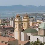 Cagliari city skyline with airport area and coastline beyond