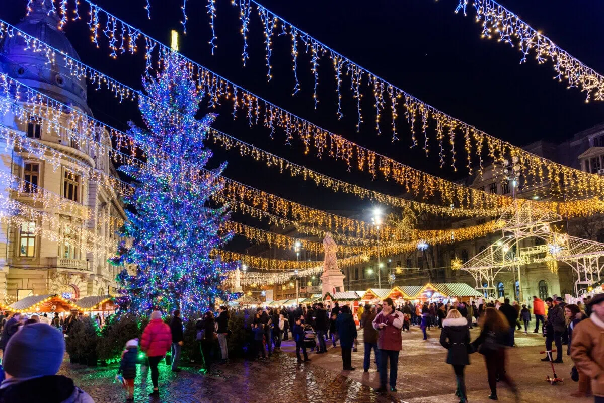 Christmas market in central Bucharest with festive lights, stalls and a large Christmas tree