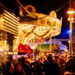 Christmas market carousel and festive lights in Cologne