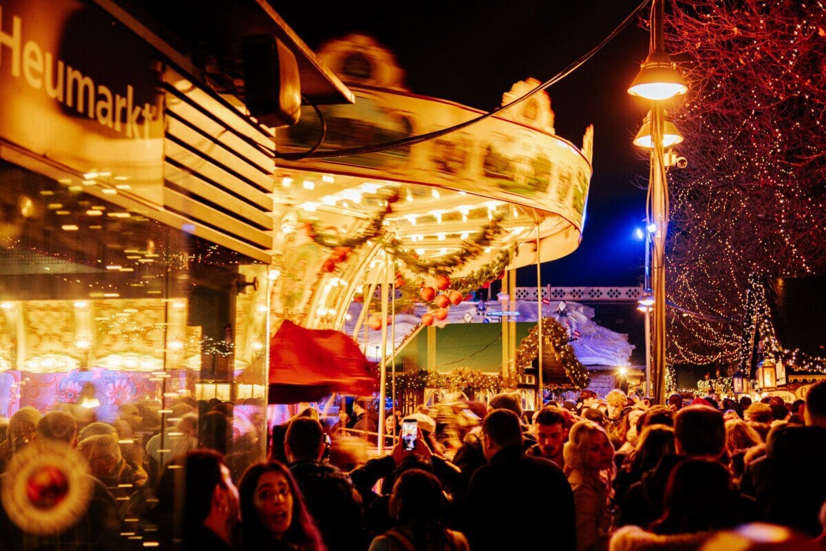 Christmas market carousel and festive lights in Cologne