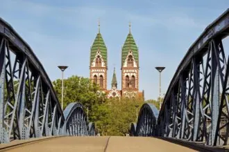 Freiburg Minster framed by the Wiwilí Bridge in Freiburg, Germany