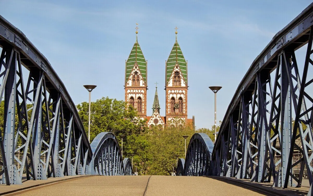 Freiburg Minster framed by the Wiwilí Bridge in Freiburg, Germany