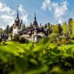 Peleș Castle in Sinaia, Romania, surrounded by the Carpathian Mountains