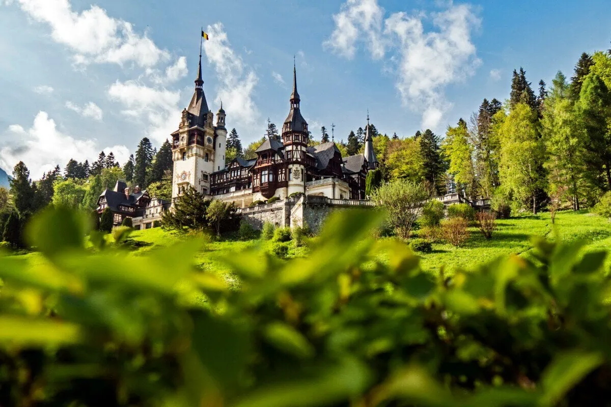 Peleș Castle in Sinaia, Romania, surrounded by the Carpathian Mountains
