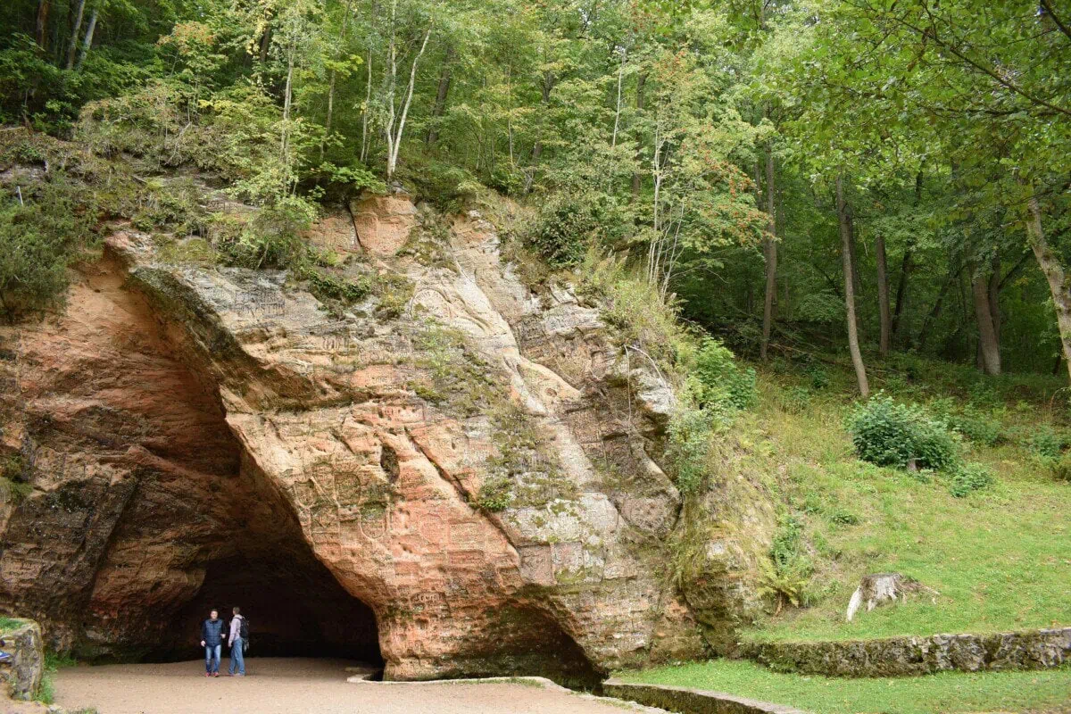 Gutmanis Cave in Gauja National Park near Sigulda Latvia surrounded by woodland