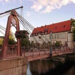 Ornate historic bridge over a river in a Swedish town on a day trip from Stockholm
