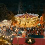 Edinburgh Christmas market with traditional carousel and festive stalls