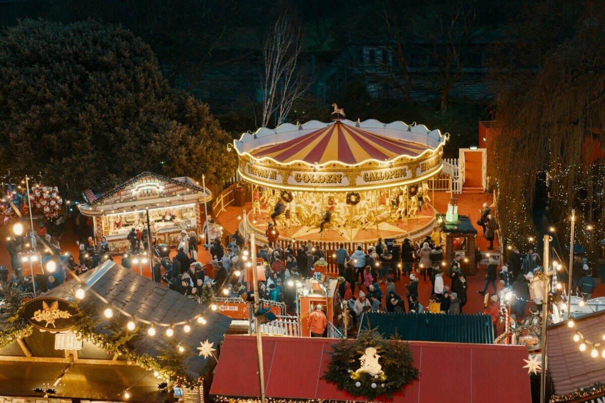 Edinburgh Christmas market with traditional carousel and festive stalls