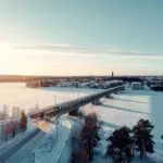 Railway bridge crossing the frozen Kemijoki River in Rovaniemi, Finnish Lapland