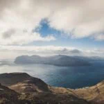 Mountainous islands and sea viewed from a high viewpoint in the Faroe Islands