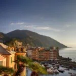 Colourful Ligurian coastal town and harbour near Genoa at sunset