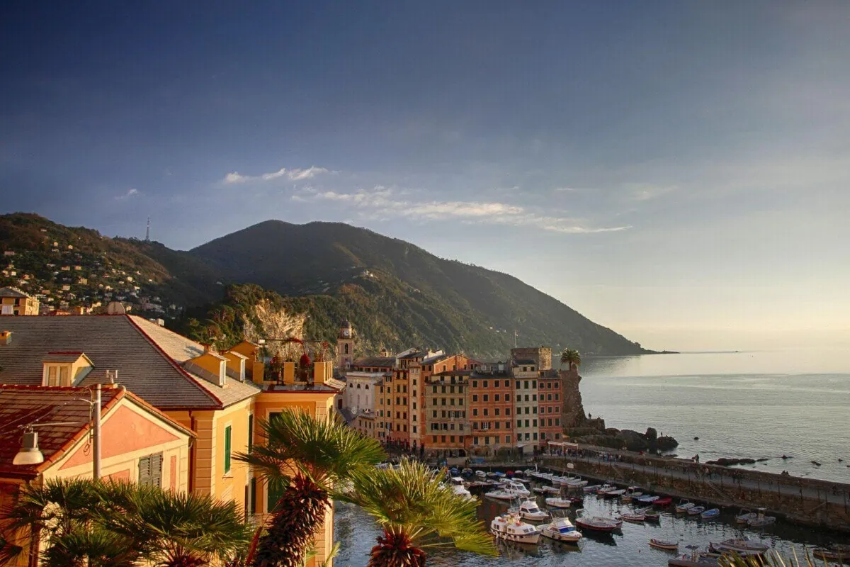 Colourful Ligurian coastal town and harbour near Genoa at sunset