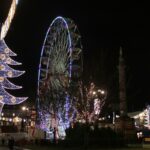 Glasgow Christmas market with Ferris wheel and festive lights