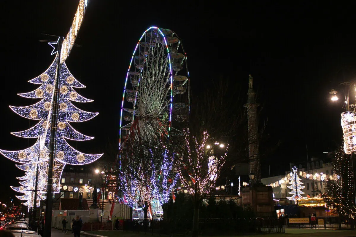 Glasgow Christmas market with Ferris wheel and festive lights