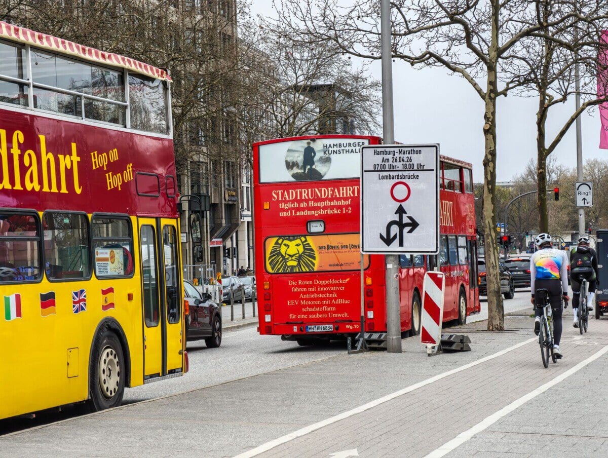 Hop-on hop-off sightseeing buses on a street in central Hamburg
