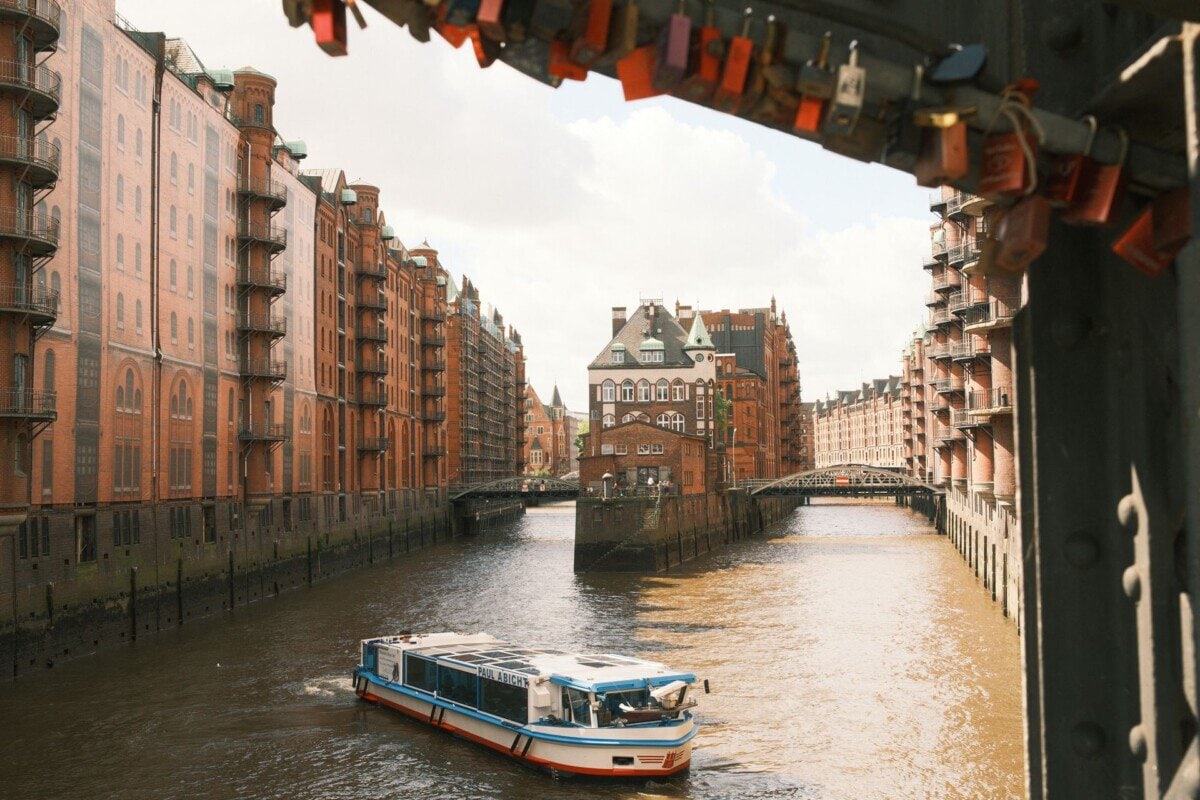 Sightseeing boat cruising through Hamburg Speicherstadt canals