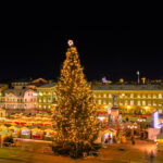 Helsinki Christmas market in Senate Square with a large illuminated Christmas tree