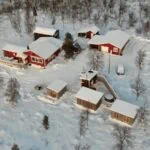 Snow-covered buildings and birch forest in Kiruna, Swedish Lapland