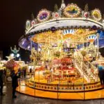 Illuminated carousel at Leipzig Christmas Market at night