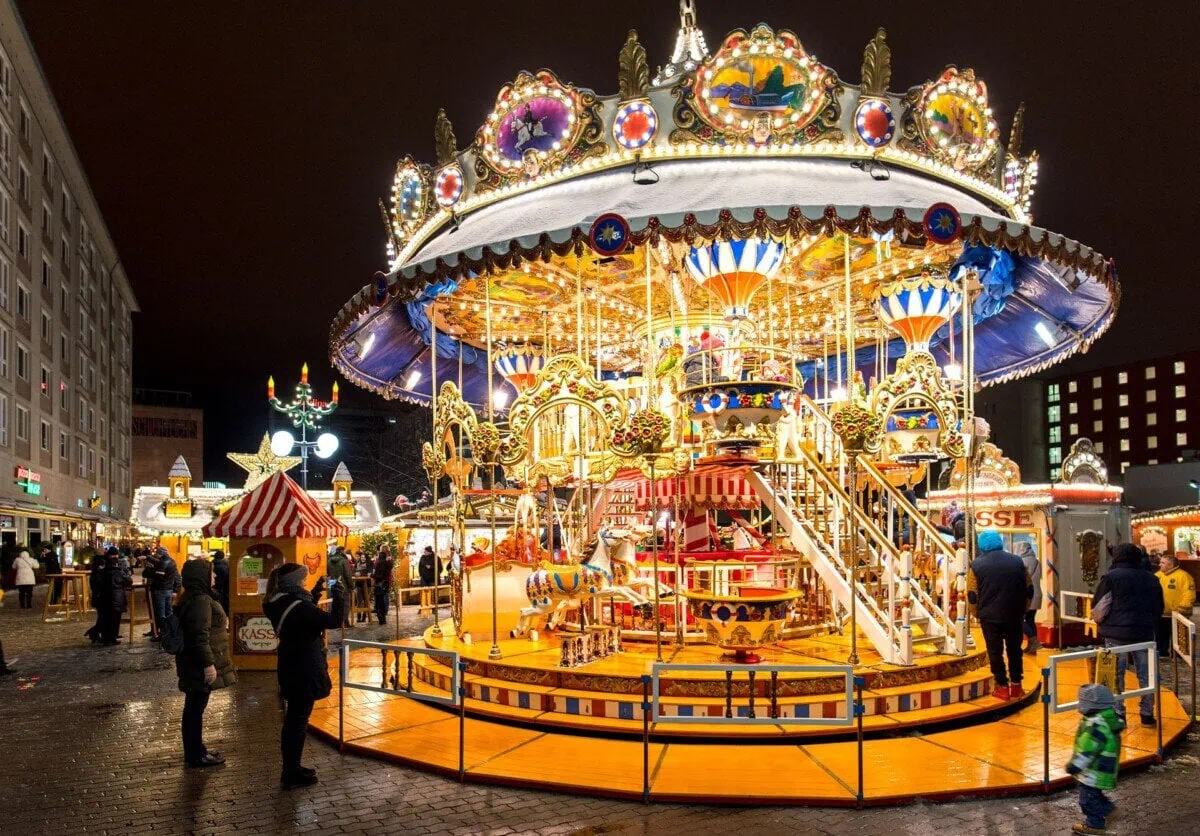 Illuminated carousel at Leipzig Christmas Market at night