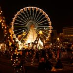 Lisbon Christmas market with Ferris wheel and festive lights