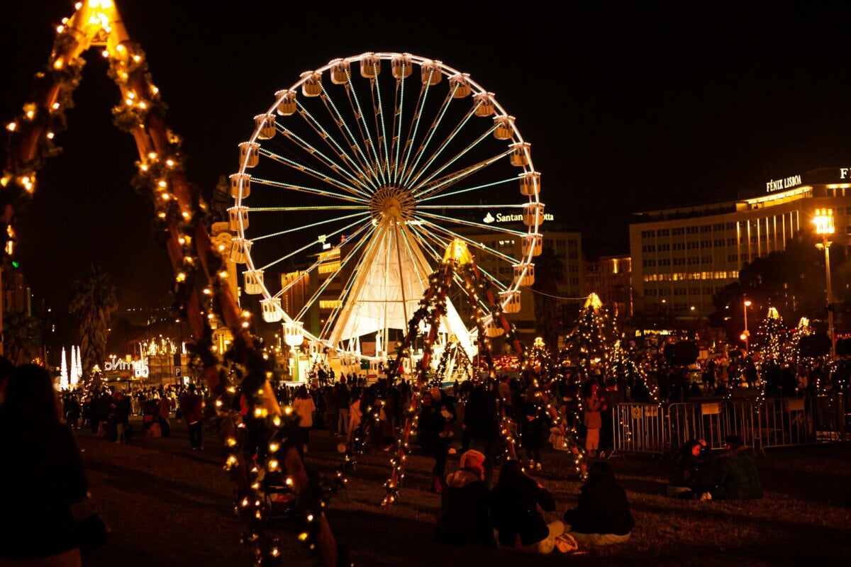 Lisbon Christmas market with Ferris wheel and festive lights