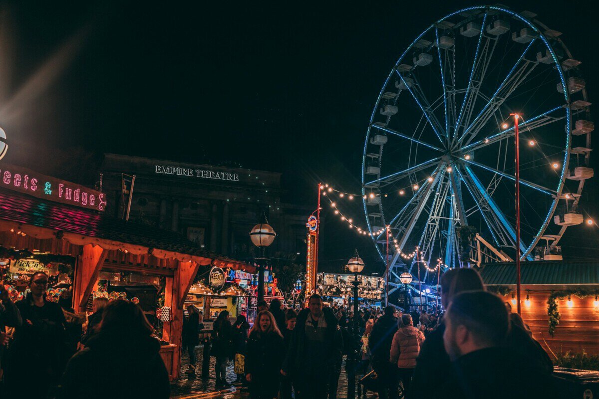 Liverpool Christmas market with Ferris wheel outside the Empire Theatre