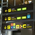 Madrid Barajas Airport terminal signs for gates and transport connections