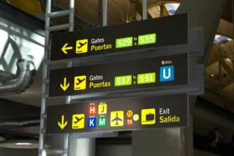 Madrid Barajas Airport terminal signs for gates and transport connections