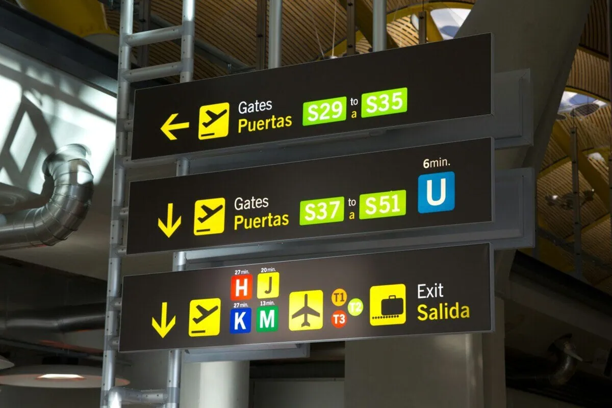 Madrid Barajas Airport terminal signs for gates and transport connections
