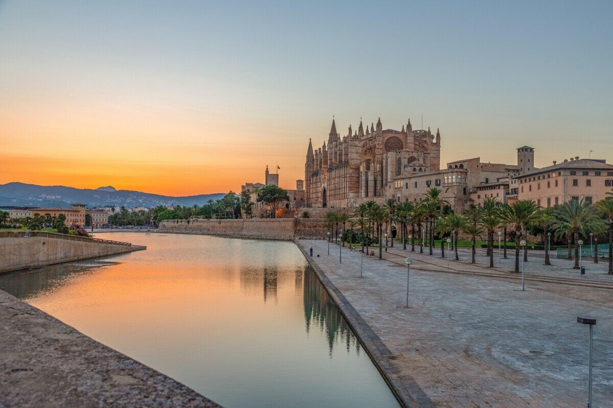 Palma Cathedral at sunset beside the waterfront in Mallorca